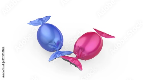 Falling blue and pink wrapped hard candies on white background
