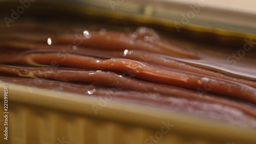 Salted Spanish anchovies small fish, a premium Mediterranean delicacy with rich canned flavor and texture. Traditional seafood ingredient, perfect for tapas, gourmet dishes, salads, pizzas, tapas