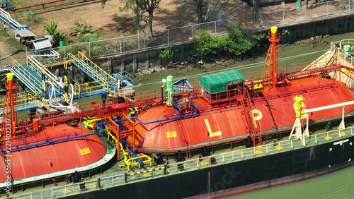 Drone perspective capturing an LPG carrier with spherical tanks and pipeline systems, reflecting global energy distribution, maritime operations, and the shift toward cleaner fuel solutions. 4k.

