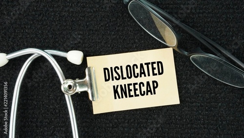 Stethoscope and paper with the word dislocated kneecap happens when the patella slips out of its normal groove on the side of the thigh bone, causing sharp pain, swelling, and a visible deformity.