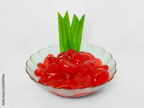 A Glass  Bowl of Red Sugar Palm Fruit or Known as Kolang Kaling Served on White Surface with a Negative Space for Copywriting 