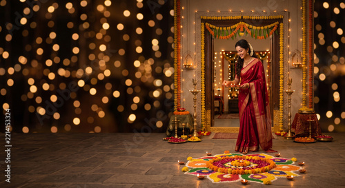 Happy Indian woman Lighting a Traditional Diya During Diwali Festival