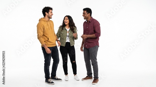 Group of three diverse young friends laughing and talking together, isolated on white background