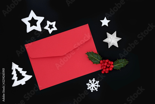Christmas mail art envelope and festive decorations, tree, stars, snowflake, holly red berries. Seasonal holiday elements on black. 