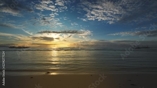 Vibrant sunrise over sea with clouds and waves, beach scene, peaceful nature, Philippines, 4k