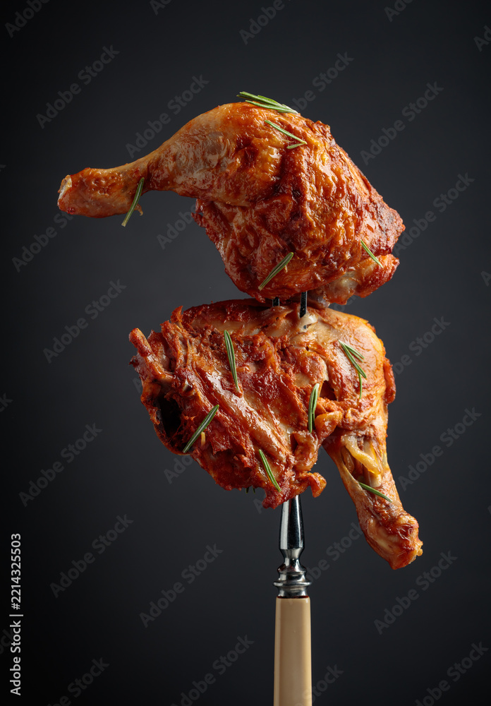 Fototapeta premium Hot chicken drumsticks on a fork.