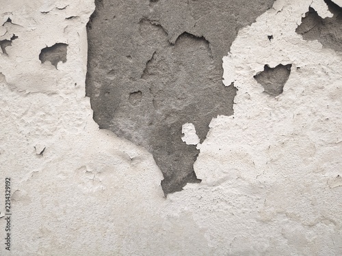 Obraz na plátně Closeup view of peeling and deteriorating old wall surface showing texture and d