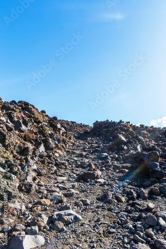 Rocky Alpine Path Leading to Mountain Ridge