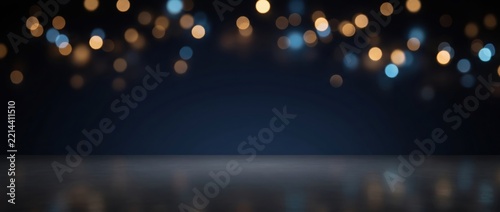 Blurred background, with golden and, blue bokeh light, circles, dark navy, blue gradient surface, horizontal composition with, soft glowing spots, of light