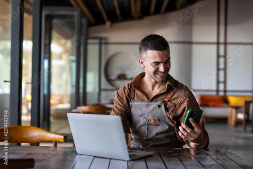 Man waiter with tablet in restaurant for a successful operation with digital tools, smart management