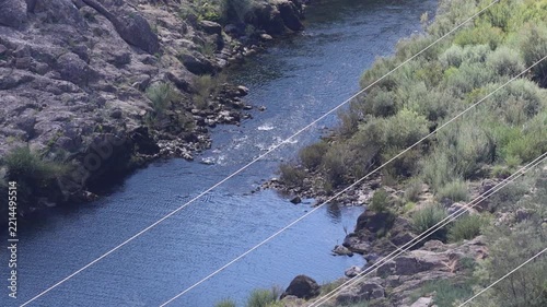 Scenic view of the zêzere river flowing through a rocky canyon in portugal