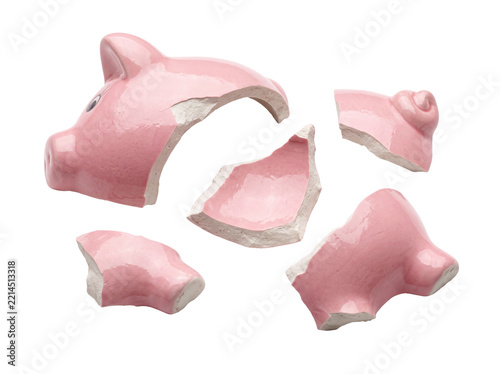 Broken pink piggy bank ceramic shattered into pieces floating on black background symbolizing financial crisis, loss of savings, inflation, bankruptcy, economic debt, and budget cuts.