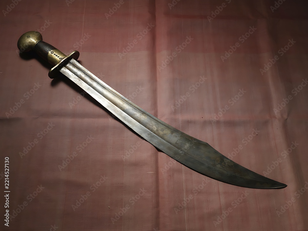 Fototapeta premium Antique falchion sword with brass hilt and wooden handle