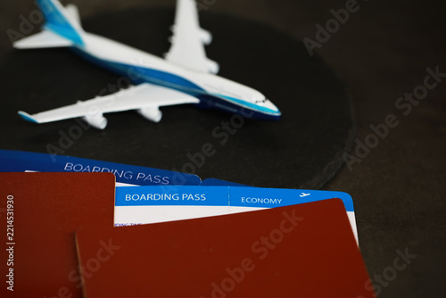 Travel Essentials: Boarding Passes and Model Airplane with Passport