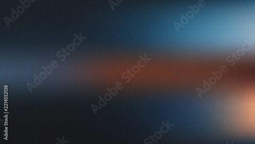 Abstract dark blue and warm brown grainy background with soft gradient blur and textured noise overlay effect