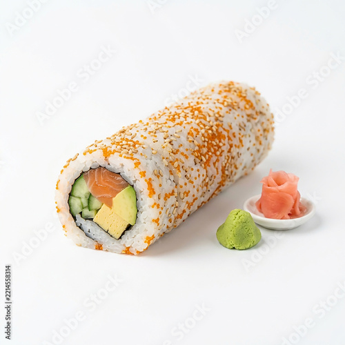 Fresh sushi roll with salmon avocado and sesame seeds on white plate