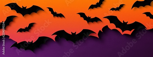 Flying bats silhouette creating spooky Halloween background banner