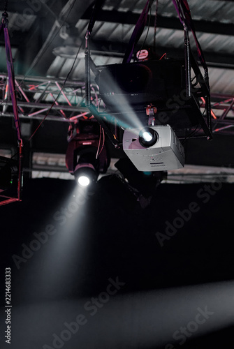Stage Projector and Spotlight Lighting Equipment Suspended Above Concert Stage With Dramatic Beams