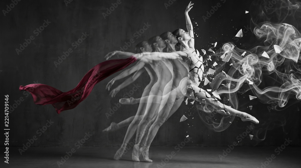 Fototapeta premium Ballerina performing ballet movement transforming into ceramic porcelain fragment particle with red silk ribbon flowing inside dark studio space representing artistic creative dance metamorphosis