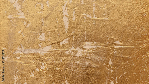 Close-up view of a golden abstract background textured Venetian plaster surfa...