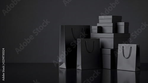 Dark Shopping Bags With Rope Handles and Stacked Boxes on Black Reflective Surface With Copy Space
