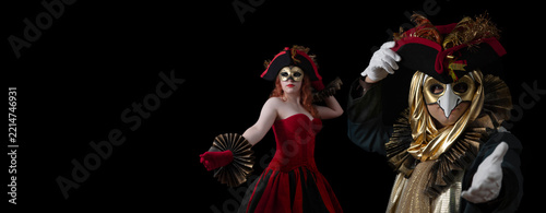 Obraz na plátně Two masked performers in elaborate red and gold costumes dancing during a tradit