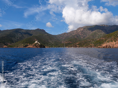 Minimalist sparkling Mediterranean sea with distant boat on horizon Corsica