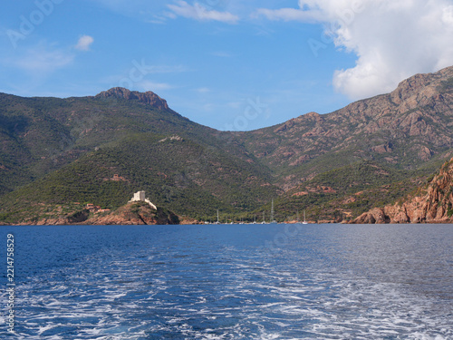 Panoramic view of Girolata bay with Genoese fort from boat Corsica