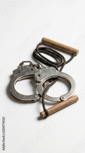 Metal Handcuffs with Wooden Handles on White Background Symbol of Justice Arrest and Constraint