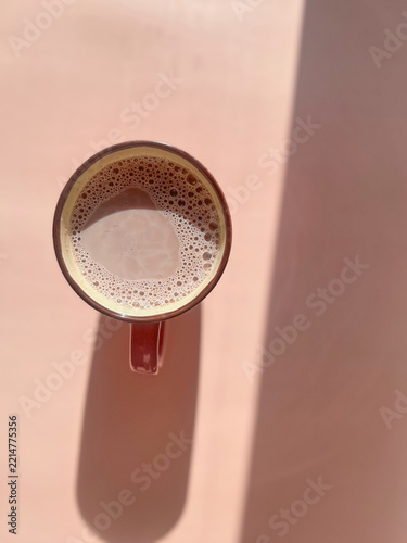 cocoa cup top view on pink background