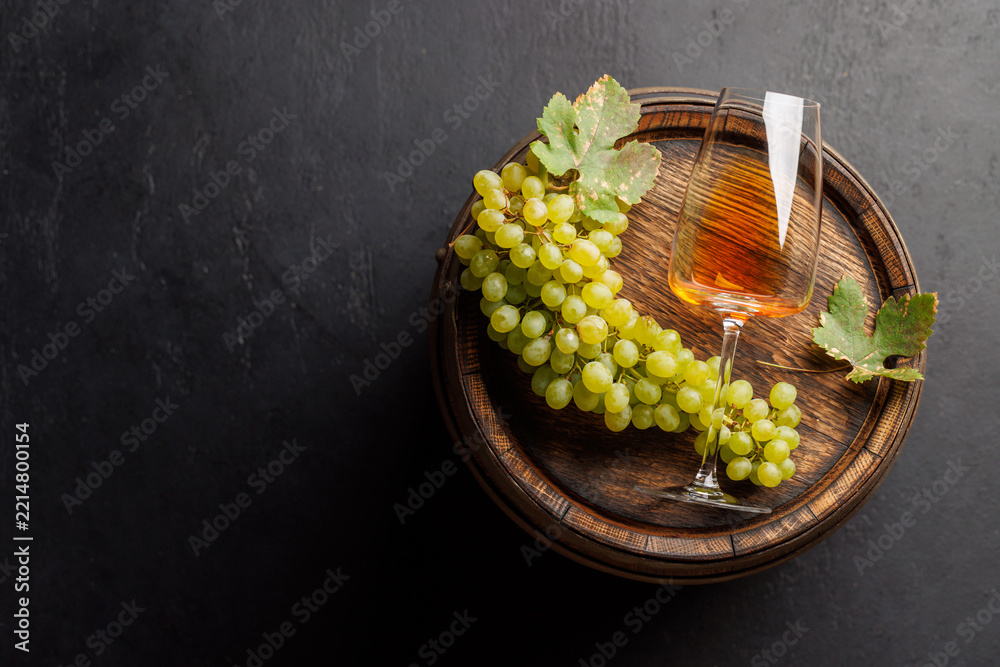 Fototapeta premium Seasonal grape harvest with a glass of pink wine