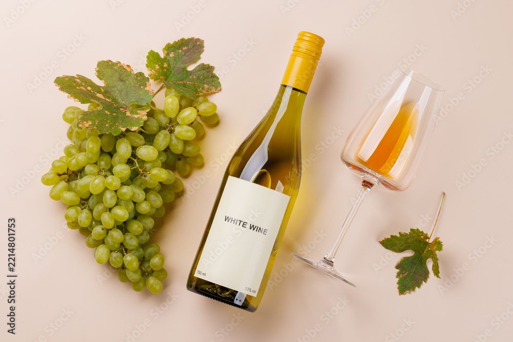 Fototapeta premium Festive white wine still life with vine leaf accents