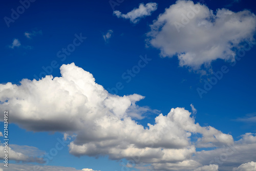 snow-white cloud ridges against a rich blue sky