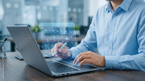 Business professional using a holographic calendar on a laptop for digital planning