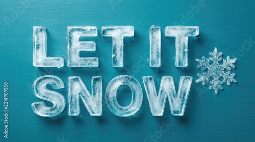 Frozen ice letters spelling let it snow message with a snowflake symbol on blue wooden background