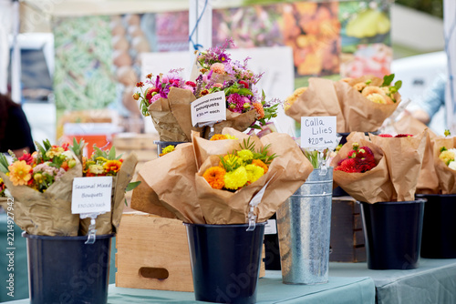 Baskets of fresh peppers for sale at an outdoor farmer's market