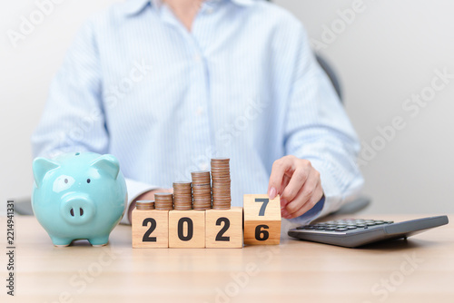 2026 end year to Happy New Year 2027 with piggy bank. Resolution, Goals, Plan, Action, Money Saving, Retirement fund, Pension, Investment and Financial concepts