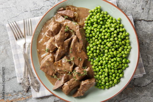liver in wine sauce is a specialty from the Baden region or Southern Germany closeup on the plate on the table. Horizontal top view from above