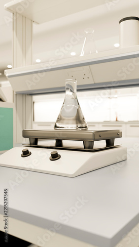 Laboratory hot plate with erlenmeyer flask filled with clear liquid