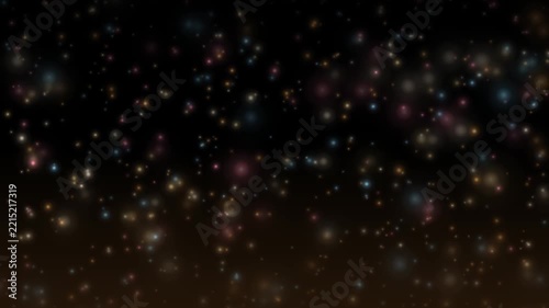 Glowing light particles floating upward against a dark background with colorful shiny dots moving slowly through space and darkness Loop Video