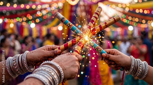 Macro shot of hands with silver bangles and henna striking dandiya sticks with sparks flying, Navratri celebration