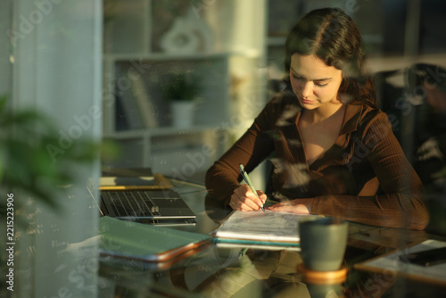 Telecommuter signing contract or form at home
