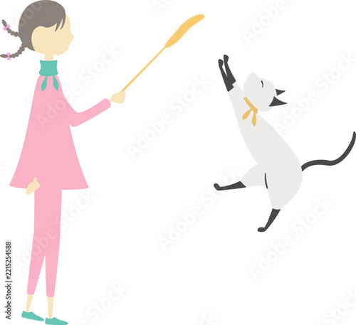 女の子とねこじゃらしで遊んでいる猫