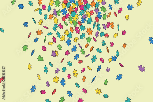 Scattered colorful jigsaw puzzle pieces on a pale yellow background