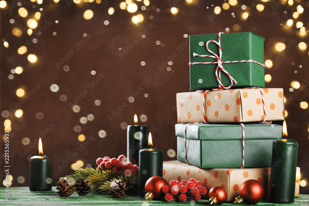 Fototapeta premium Christmas and New Year holiday gift stack with festive decorations