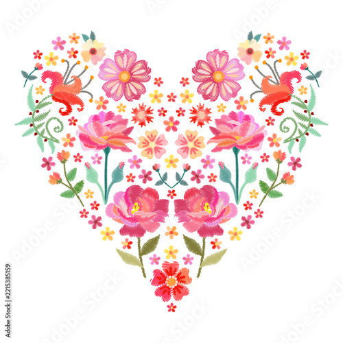 Floral heart with beautiful embroidered ornament from bright flowers on white background
