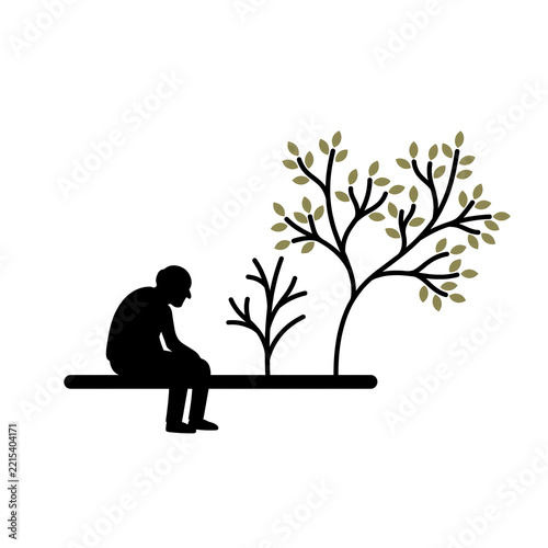 Silhouette of an elderly man sitting by growing and dying trees