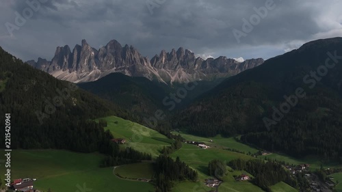 serene mountain range aerial view rural valley green fields scattered houses nature landscape travel perspective clean background modern design resource web banner poster copyspace vivid.