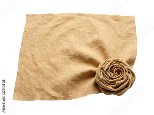 Fotografie Square fabric napkin crafted from natural beige linen featuring a neatly rolled