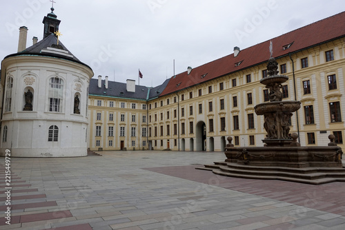 The Chapel of the Holy Rood and Kohl's Fountain situated in the second courtyard of Prague Castle surrounded by historic baroque palace wings.